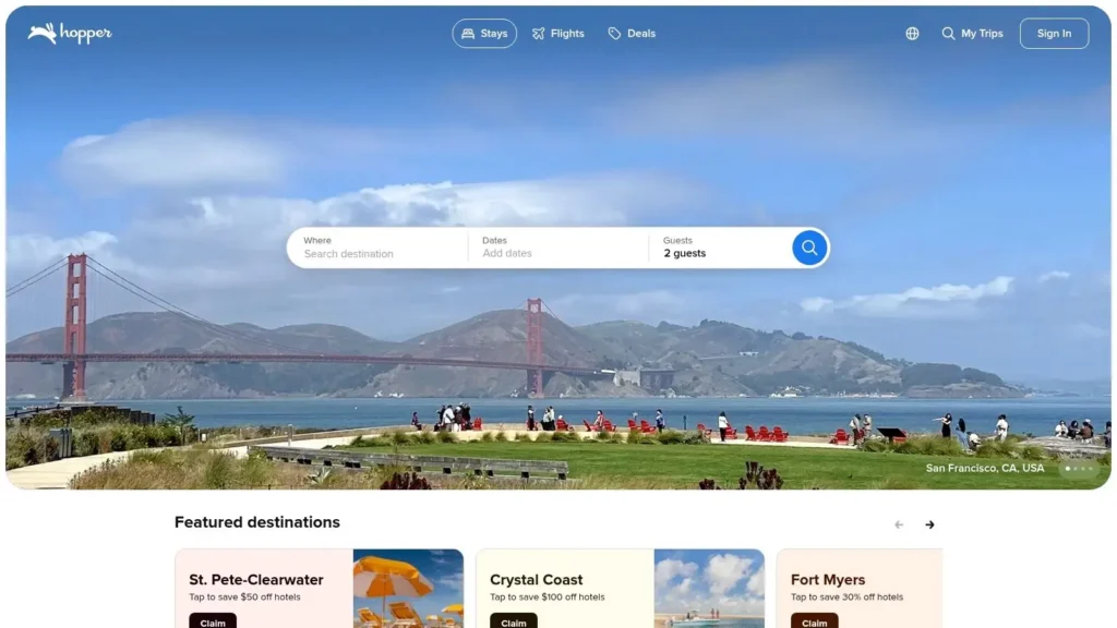 Hopper travel app homepage with destination search bar over a San Francisco Golden Gate Bridge background and featured hotel deals below.