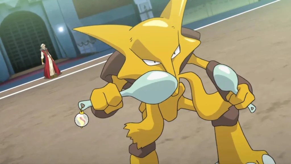 Alakazam holds two spoons in a battle arena, focusing intensely as its trainer watches from the background.
