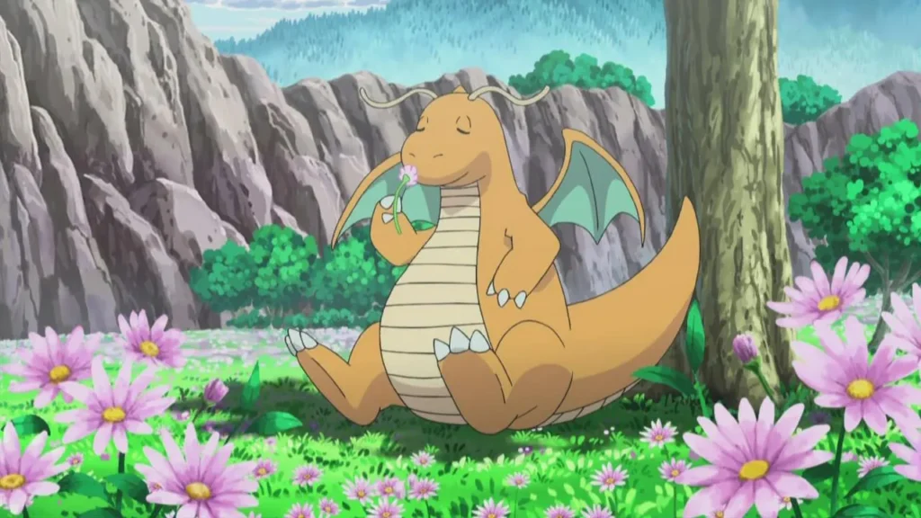 Dragonite peacefully smells a pink flower while resting beneath a tree in a colorful mountain meadow.