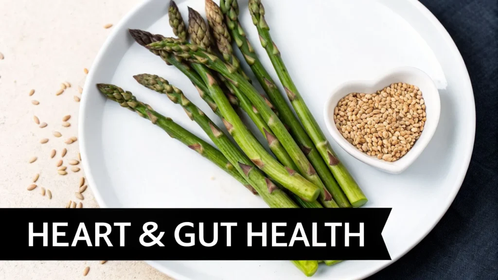 Fresh asparagus spears on a plate with seeds, text “Heart & Gut Health,” highlighting digestive and heart benefits.