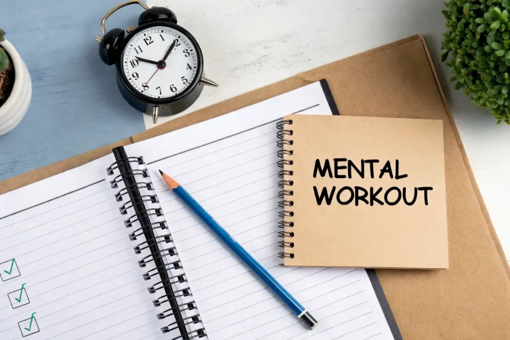 Notebook, pencil, alarm clock, and notepad labeled “Mental Workout,” symbolizing exercises to improve critical thinking skills.