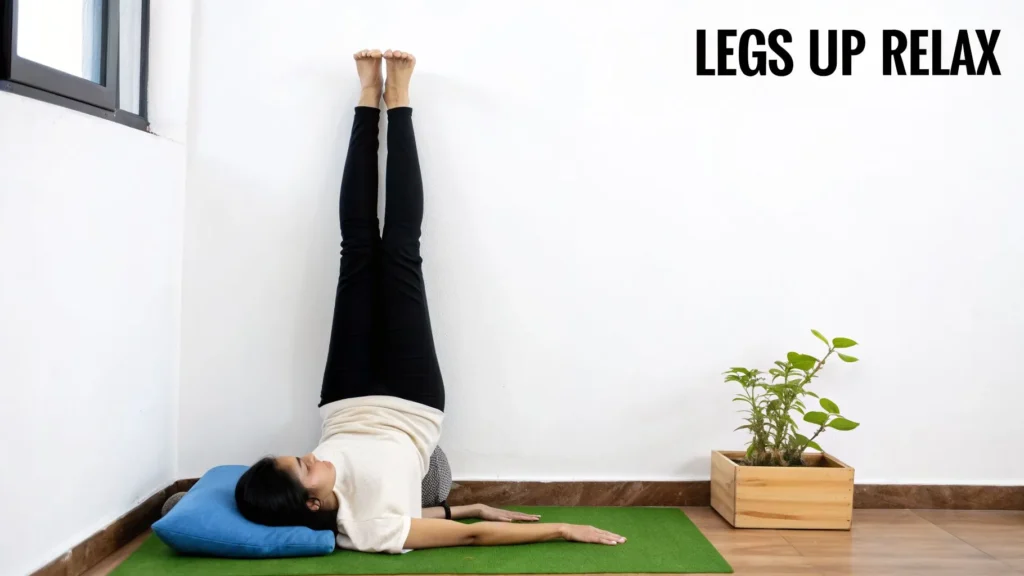 Person doing legs-up-the-wall yoga pose on a mat with cushion support, promoting relaxation and stress relief.