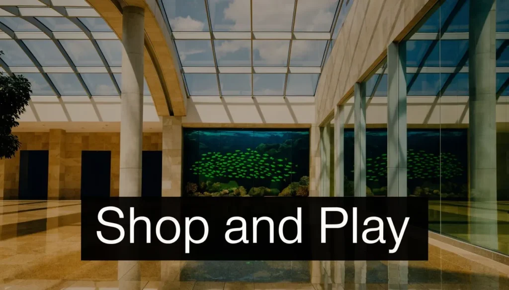 Modern shopping mall interior with a large aquarium display and “Shop and Play” text.
