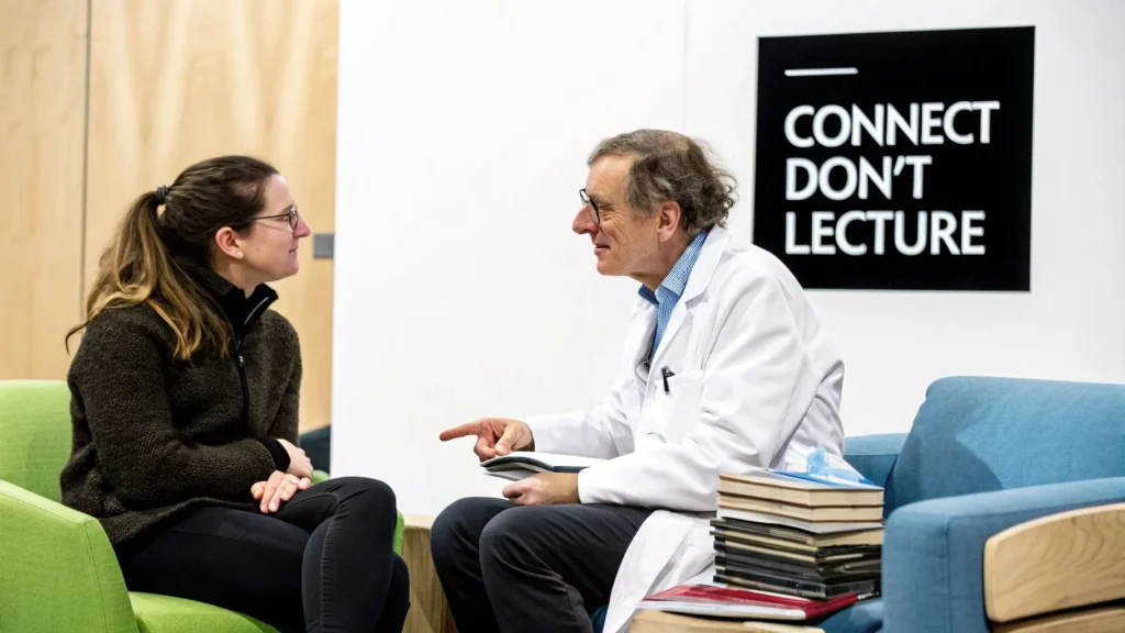 Doctor speaking with a woman in a clinic, with sign reading "Connect, don’t lecture" in background
