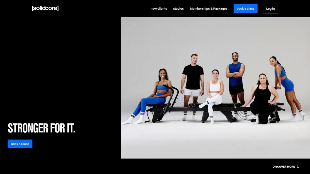 The 7 Best Exercise Classes NYC Has to Offer in 2026 Solidcore fitness class homepage featuring diverse athletes, reformer equipment, and “Stronger for It” workout slogan.