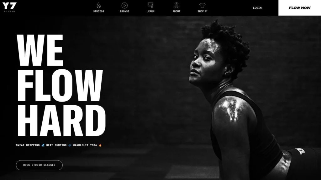 The 7 Best Exercise Classes NYC Has to Offer in 2026 Y7 Studio homepage with bold “We Flow Hard” slogan and athlete promoting yoga and fitness classes.