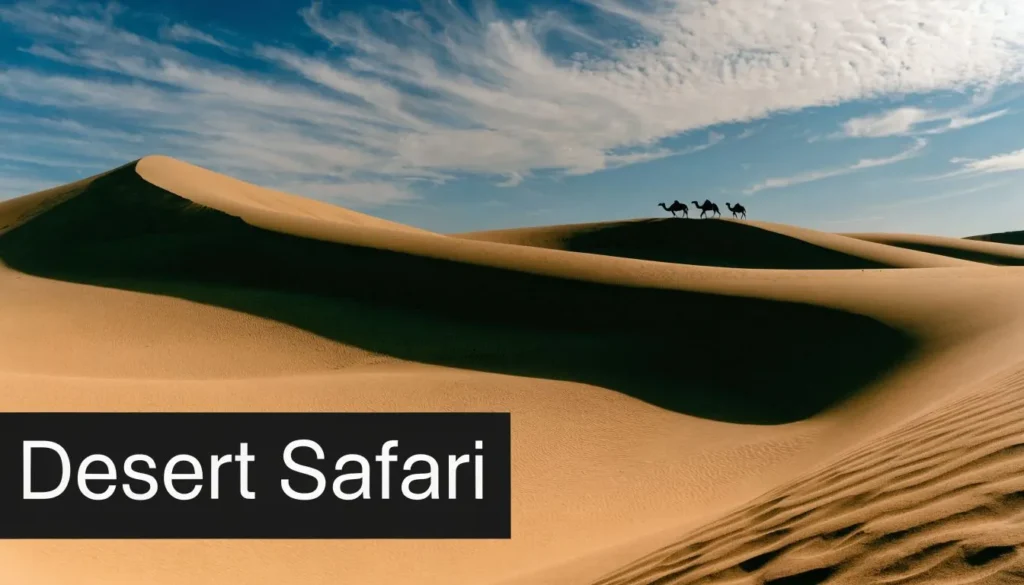 Camel caravan crossing golden sand dunes during a desert safari, showcasing India
