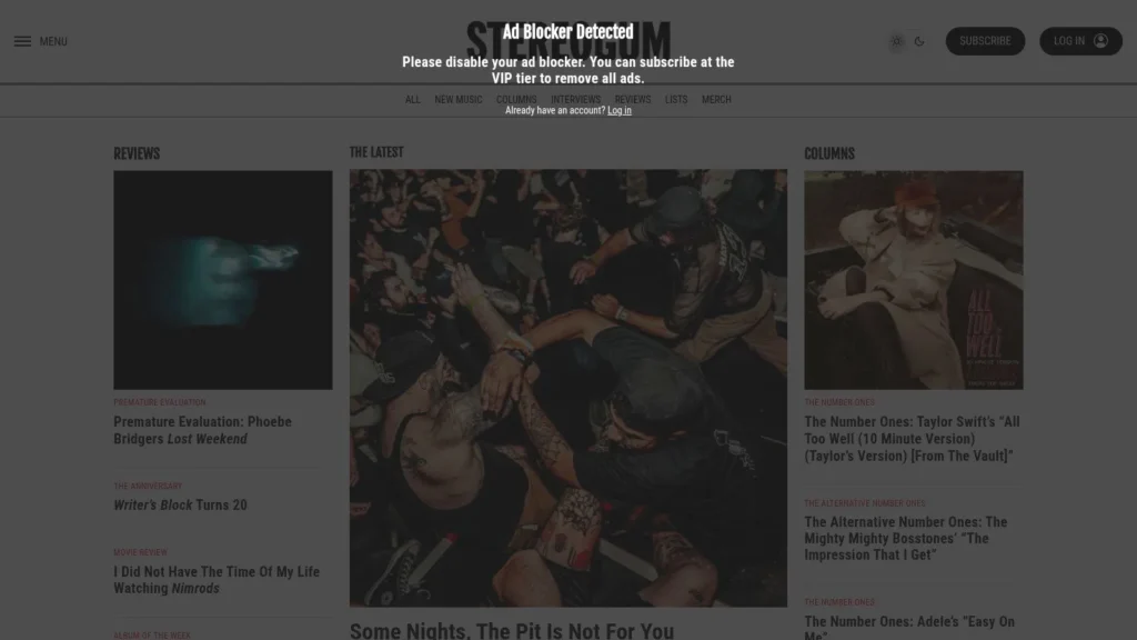 Stereogum music website homepage with reviews, latest music stories, columns, and an ad blocker detected overlay.